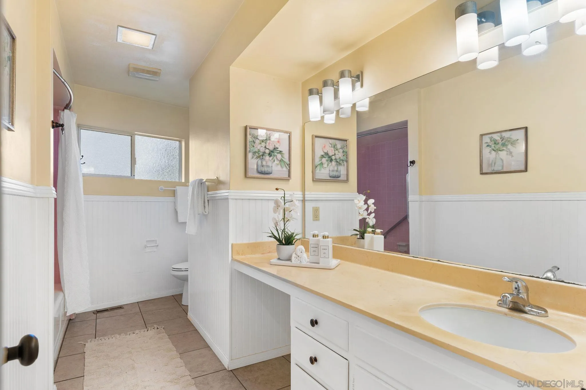 5111 Dorman Drive San Diego, CA 92115 - Photo 25 of 59 a bathroom with a sink a vanity and a mirror