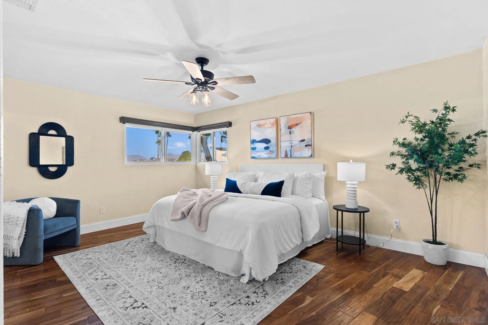 5111 Dorman Drive San Diego, CA 92115 - Photo 27 of 59 a spacious bedroom with a bed and a potted plant
