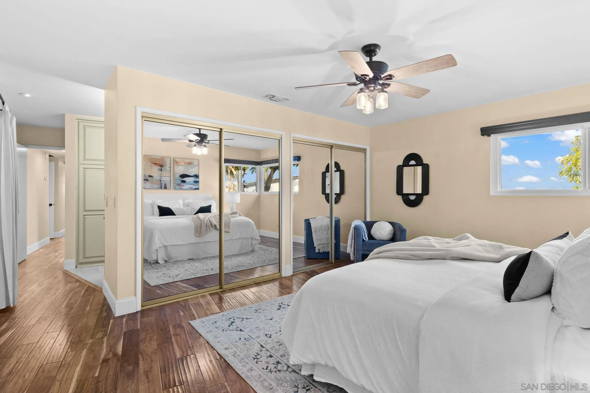 5111 Dorman Drive San Diego, CA 92115 - Photo 28 of 59 a bedroom with a bed and a chandelier