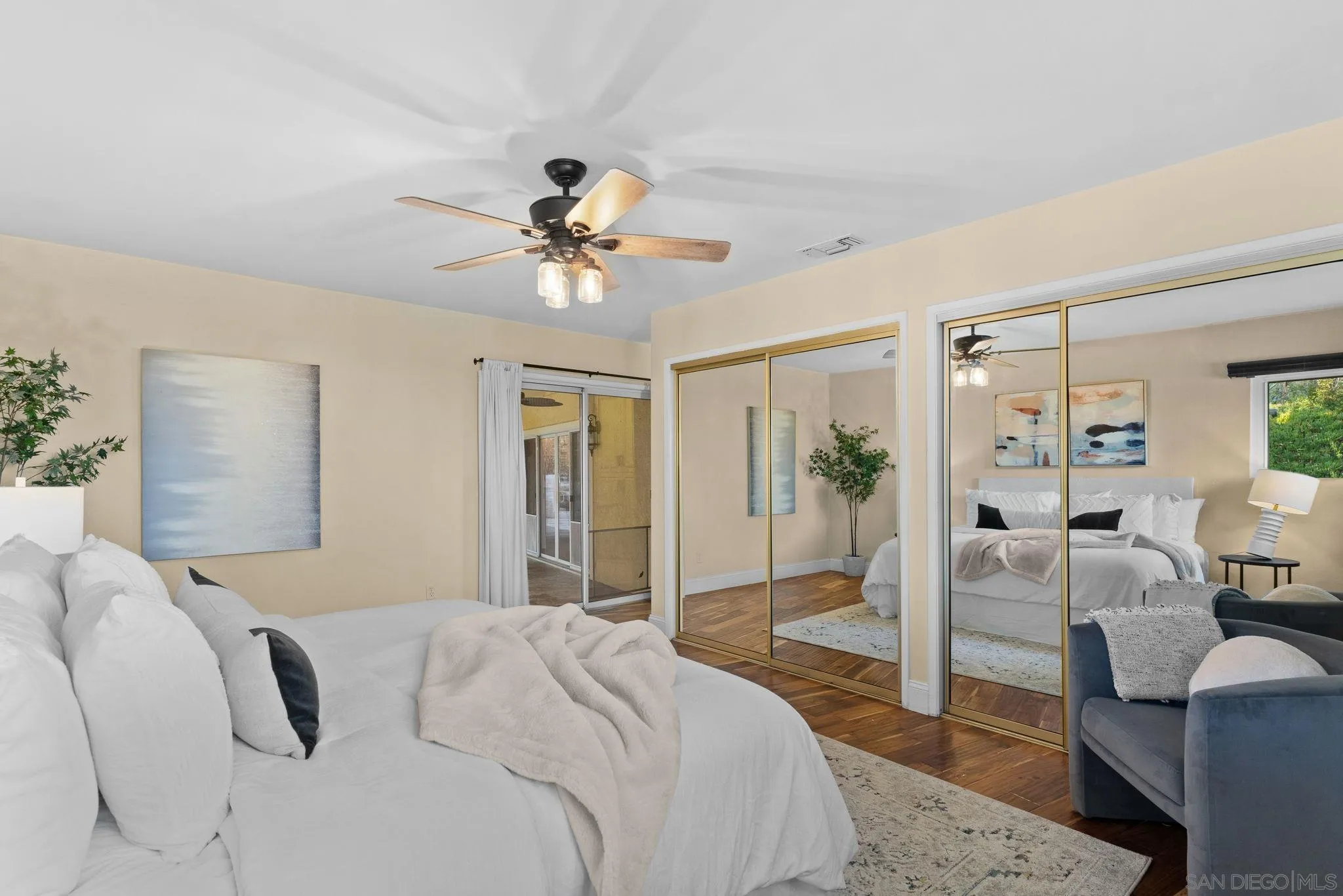 5111 Dorman Drive San Diego, CA 92115 - Photo 29 of 59 a bedroom with a bed large window and couch