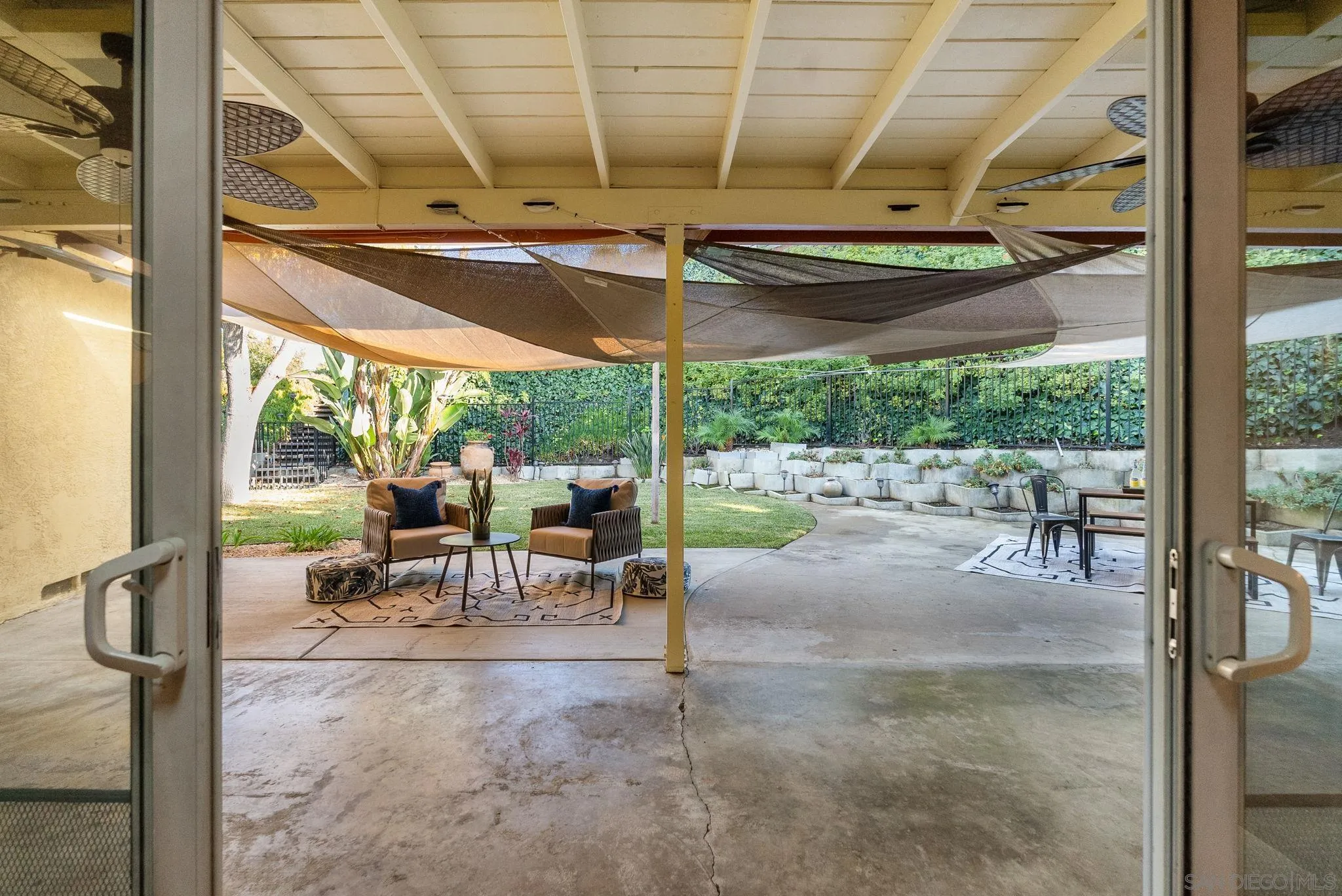 5111 Dorman Drive San Diego, CA 92115 - Photo 32 of 59 a view of a patio with a table chairs and backyard