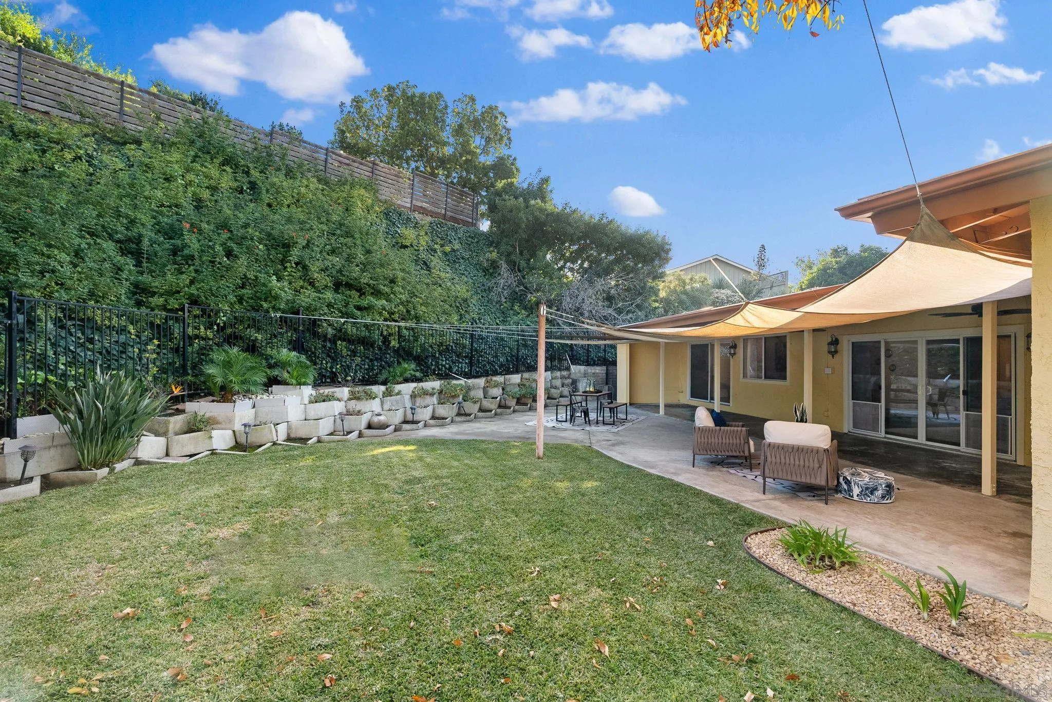 5111 Dorman Drive San Diego, CA 92115 - Photo 35 of 59 a view of a house with backyard porch and sitting area