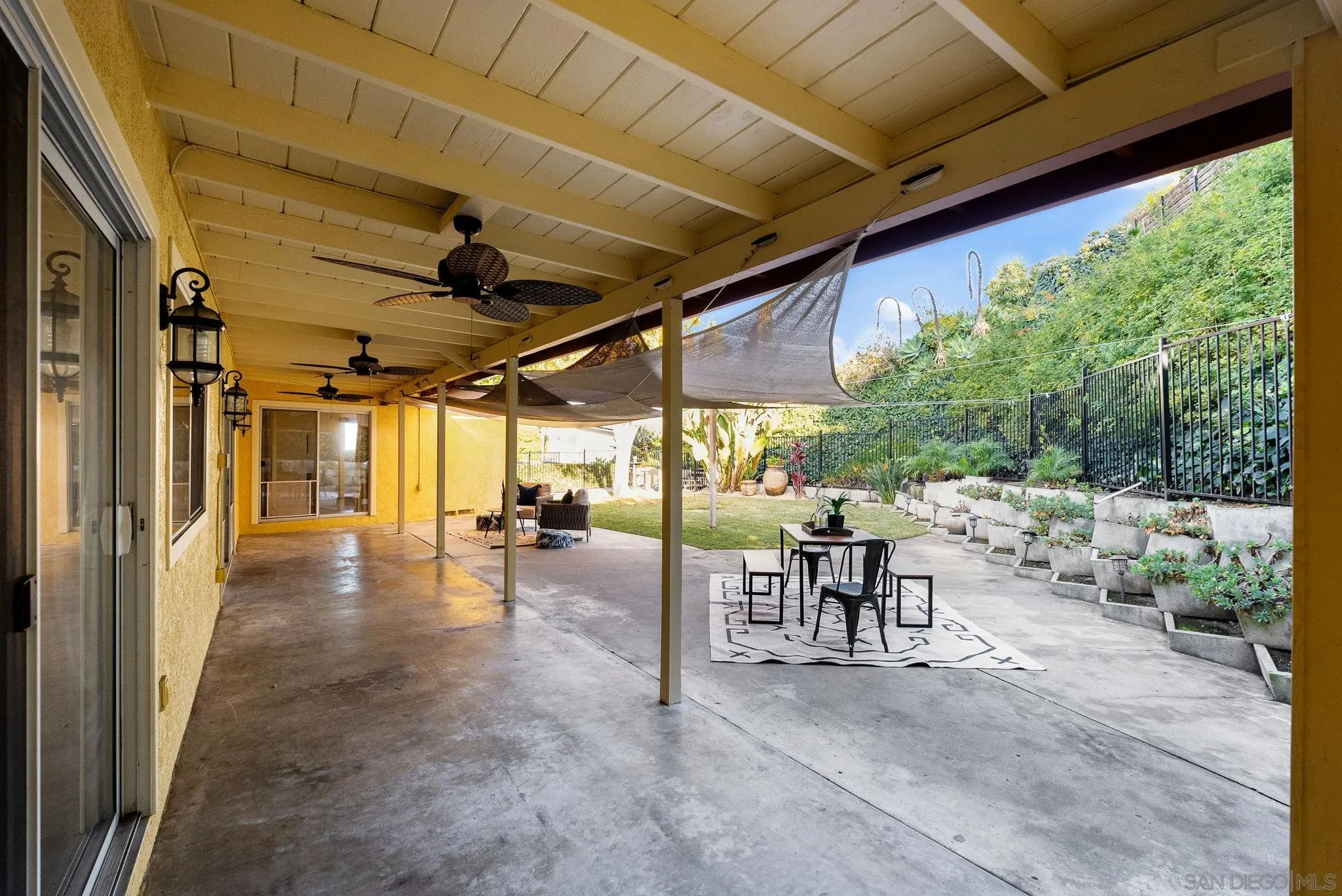5111 Dorman Drive San Diego, CA 92115 - Photo 38 of 59 a view of a porch with chairs and backyard