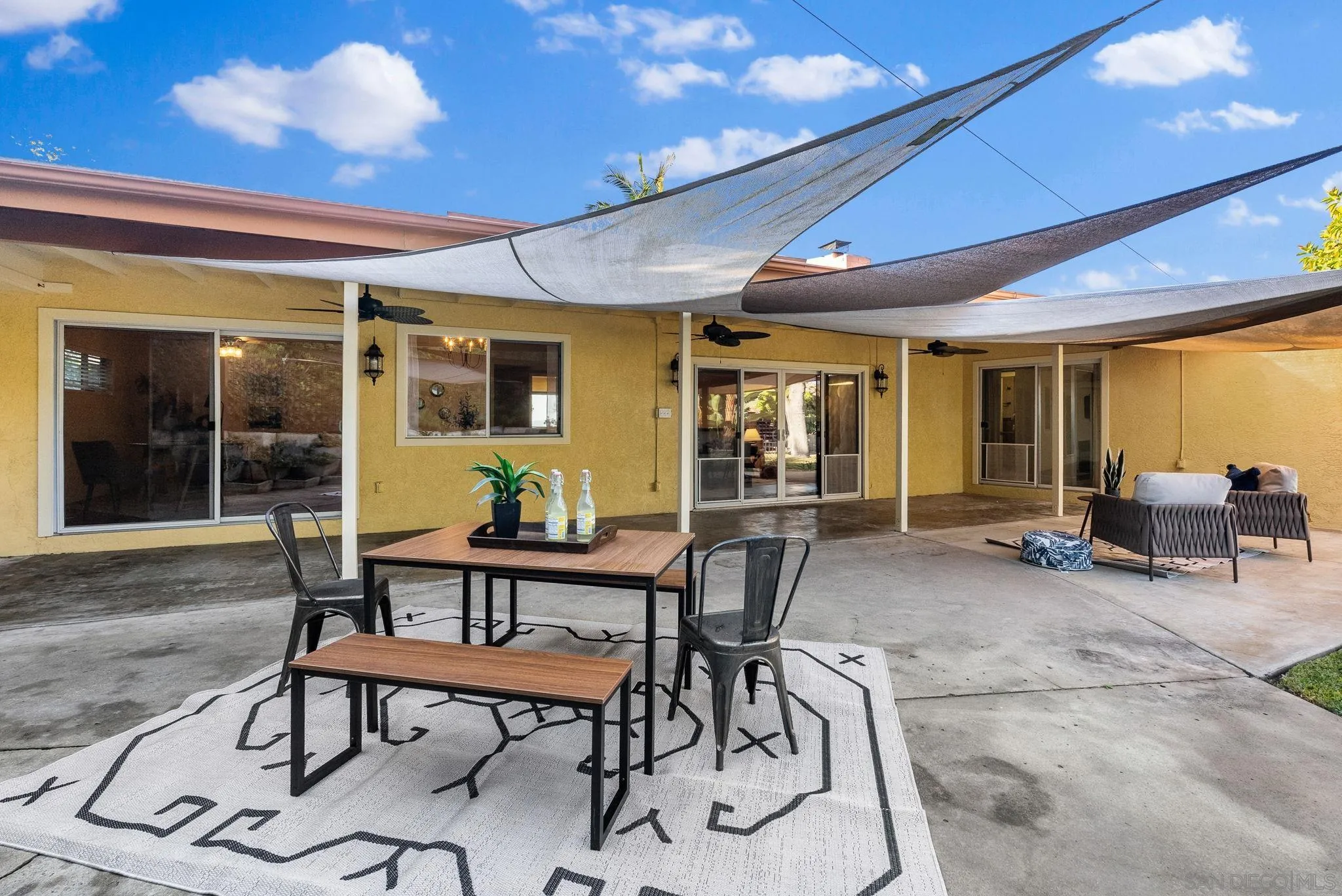 5111 Dorman Drive San Diego, CA 92115 - Photo 40 of 59 a view of a dinning room with furniture and floor to ceiling window