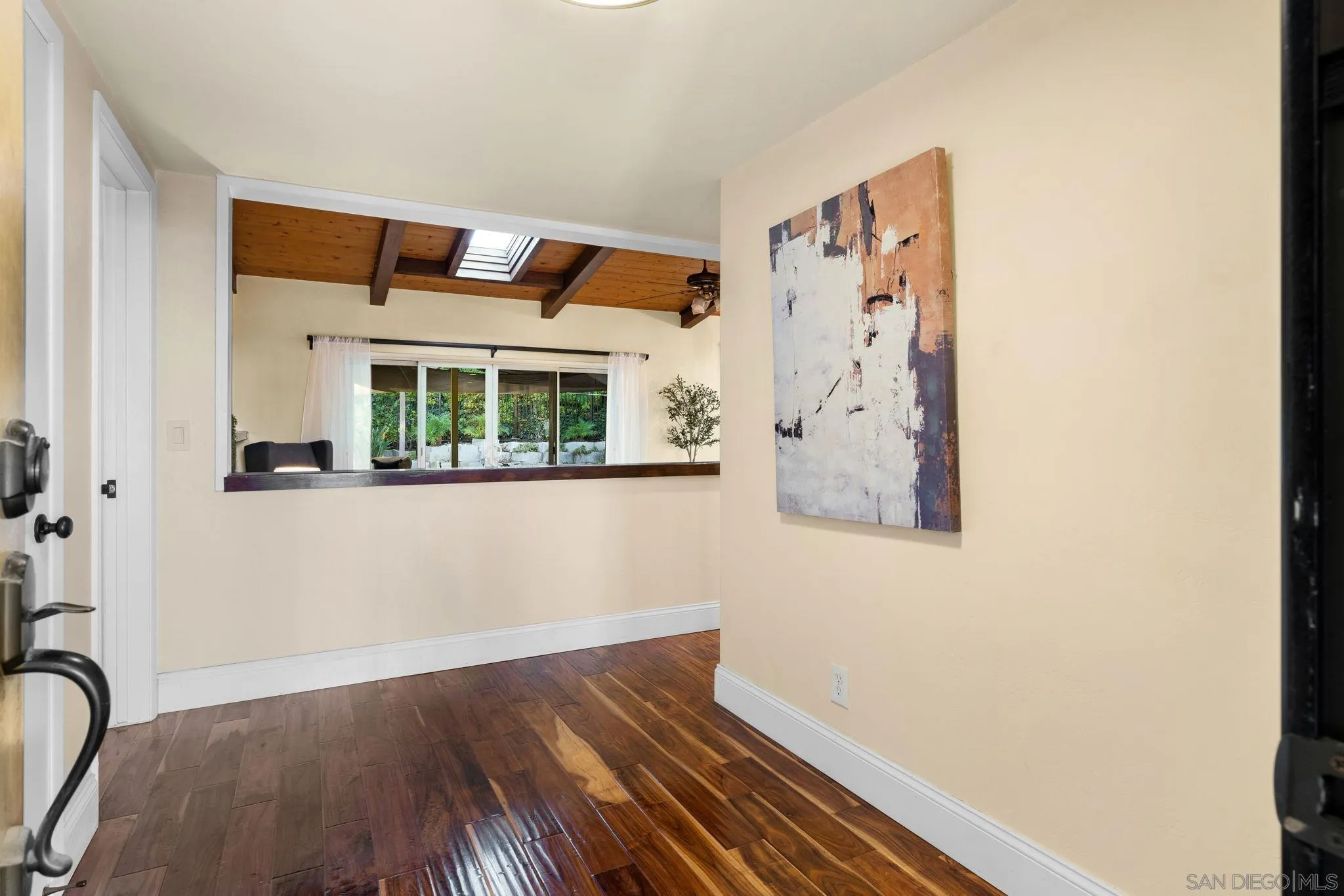 5111 Dorman Drive San Diego, CA 92115 - Photo 4 of 59 a view of a bedroom with wooden floor and a large window