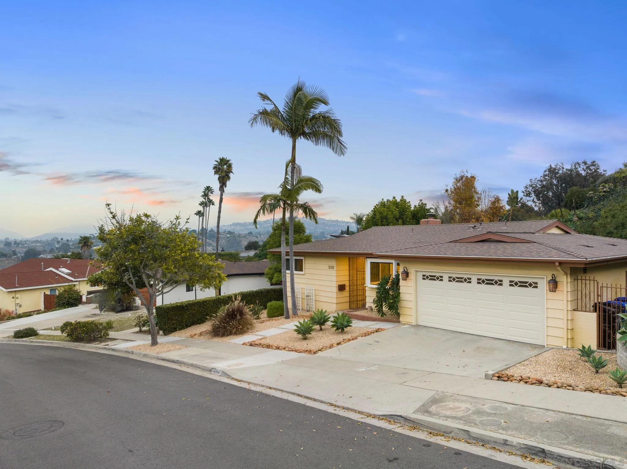 5111 Dorman Drive San Diego, CA 92115 - Photo 49 of 59 a front view of a house with a yard and garage
