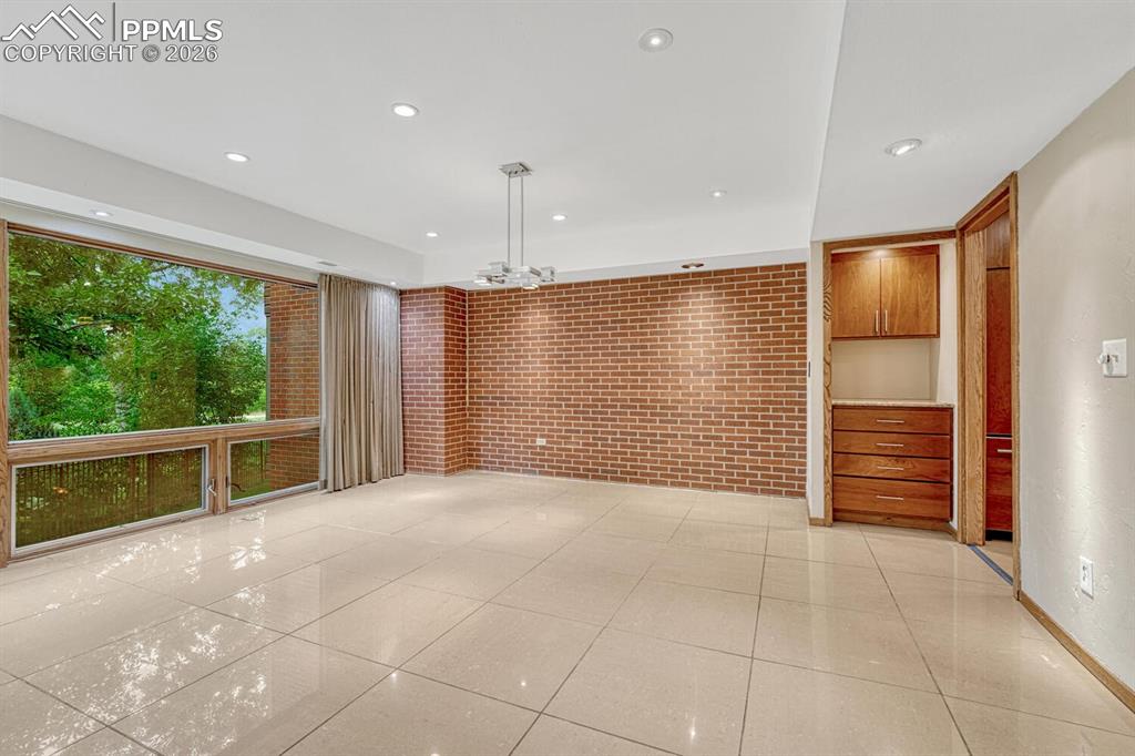 75 East Boulder Street Colorado Springs, CO 80903 - Photo 18 of 50 a view of an empty room with a fireplace and a window