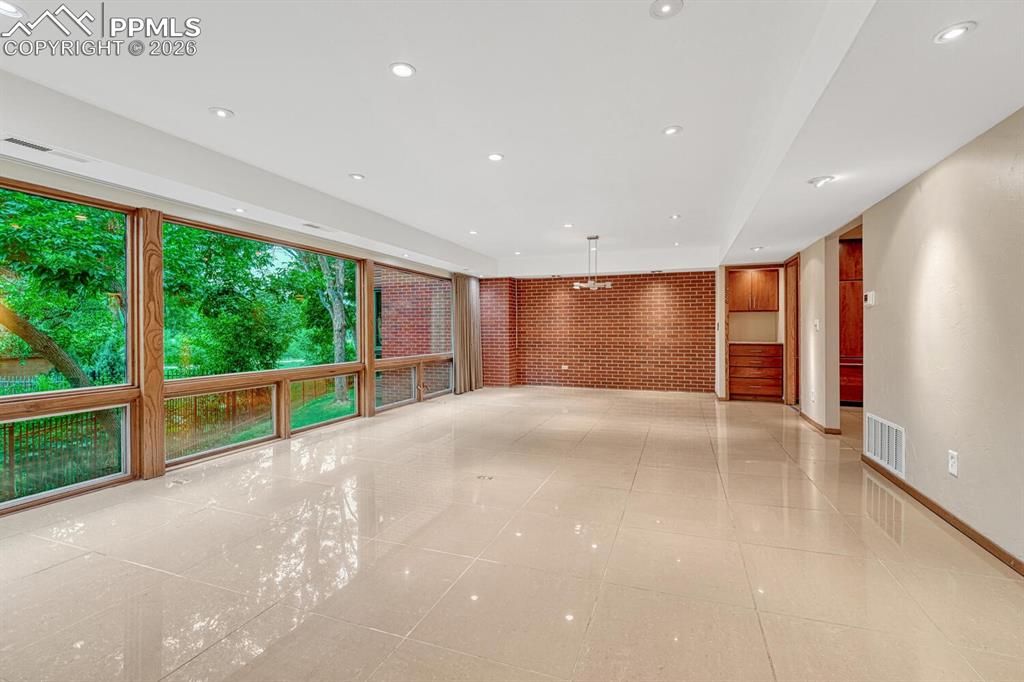 75 East Boulder Street Colorado Springs, CO 80903 - Photo 21 of 50 a view of empty room with wooden floor and fan