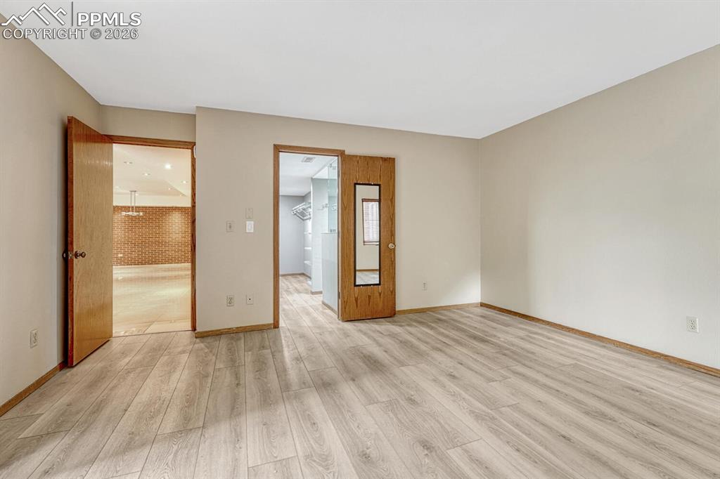 75 East Boulder Street Colorado Springs, CO 80903 - Photo 23 of 50 a view of an empty room with wooden floor and closet