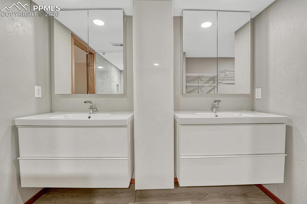 75 East Boulder Street Colorado Springs, CO 80903 - Photo 27 of 50 a bathroom with a sink and a mirror