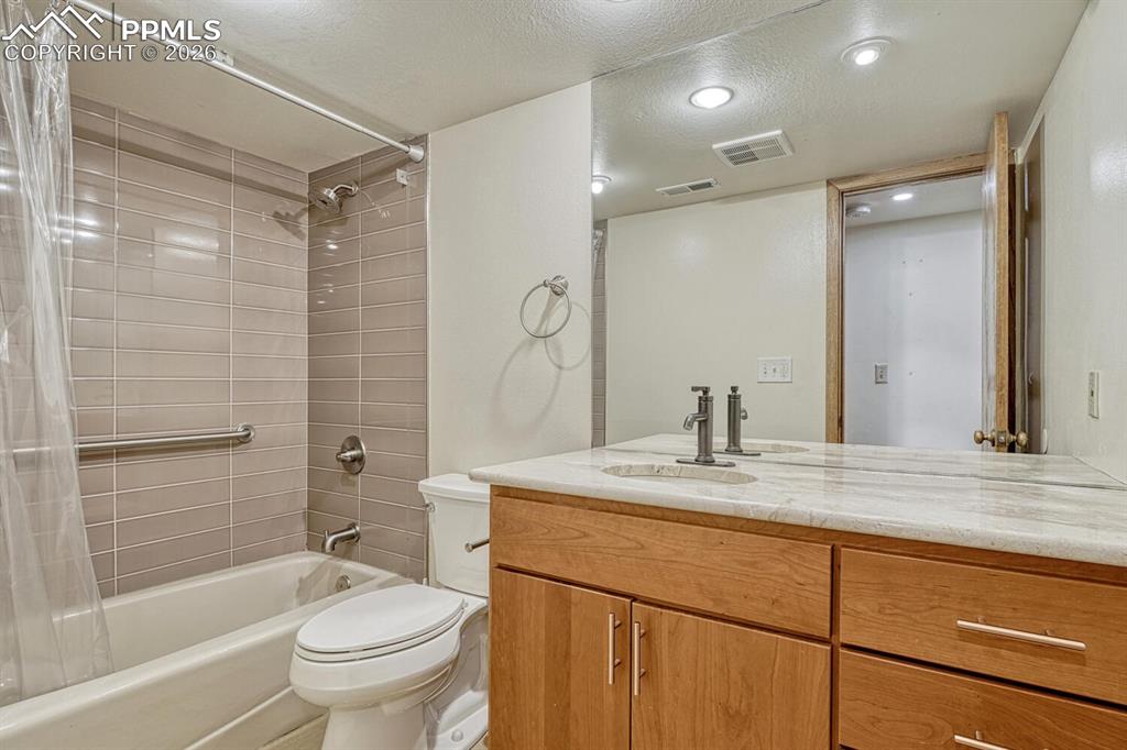 75 East Boulder Street Colorado Springs, CO 80903 - Photo 33 of 50 a bathroom with a sink toilet and shower