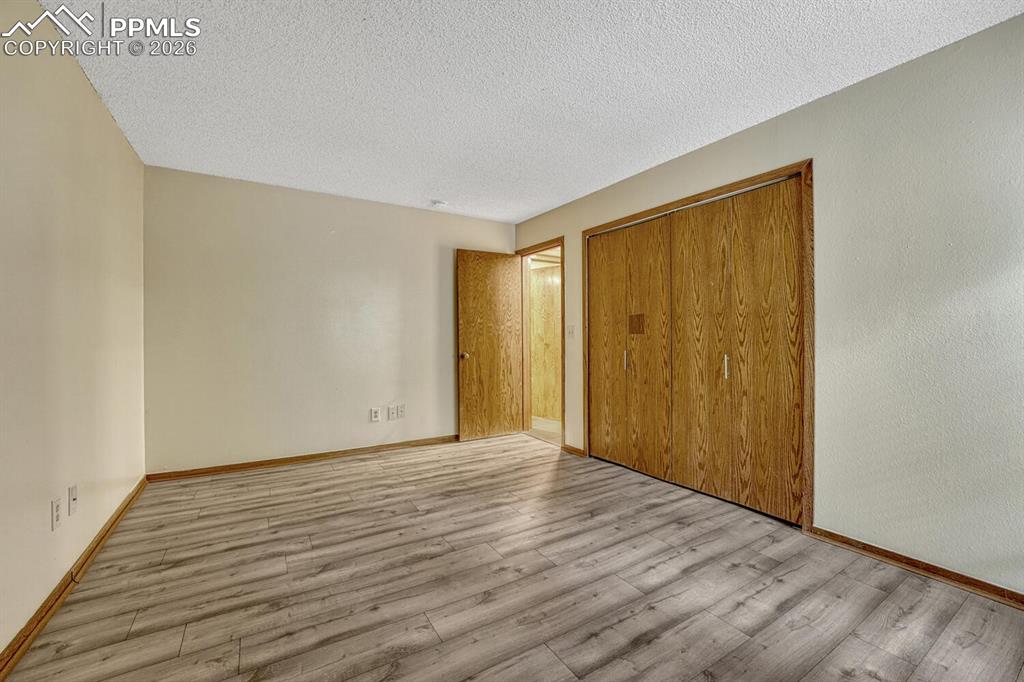 75 East Boulder Street Colorado Springs, CO 80903 - Photo 36 of 50 a view of an empty room with wooden floor and a window