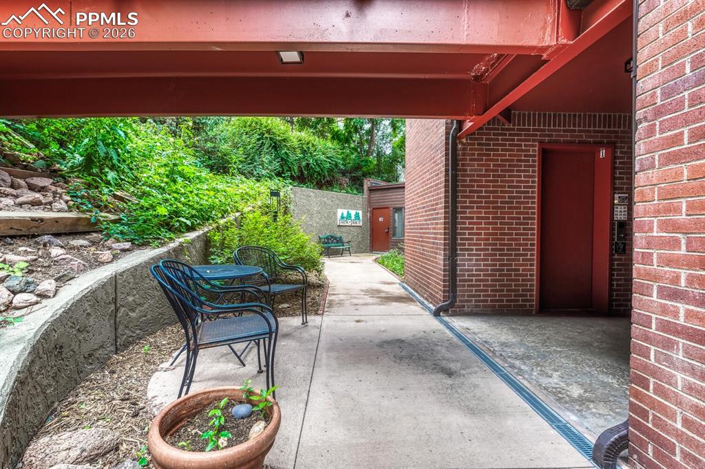 75 East Boulder Street Colorado Springs, CO 80903 - Photo 4 of 50 a view of an outdoor sitting area with brick walls