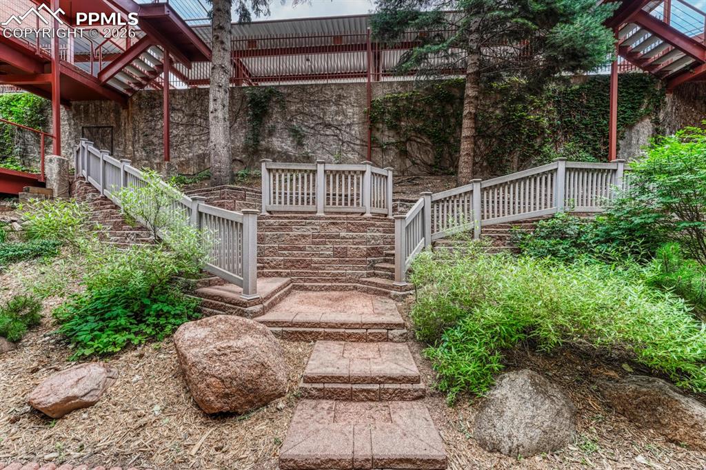 75 East Boulder Street Colorado Springs, CO 80903 - Photo 4 of 50 a view of a pathway with a house