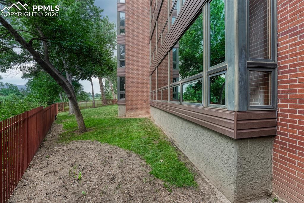 75 East Boulder Street Colorado Springs, CO 80903 - Photo 42 of 50 a view of a wooden deck with a bench