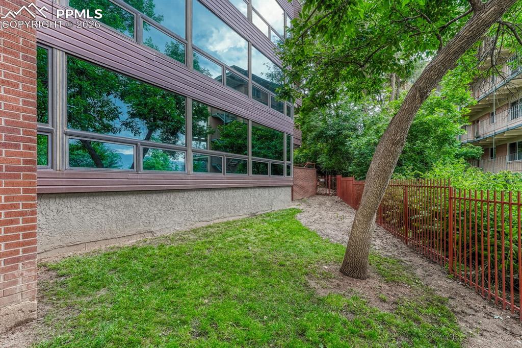 75 East Boulder Street Colorado Springs, CO 80903 - Photo 42 of 50 a view of a house with backyard and porch