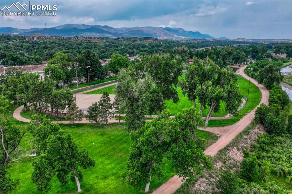 75 East Boulder Street Colorado Springs, CO 80903 - Photo 45 of 50 a view of a lush green hillside and a building in the background