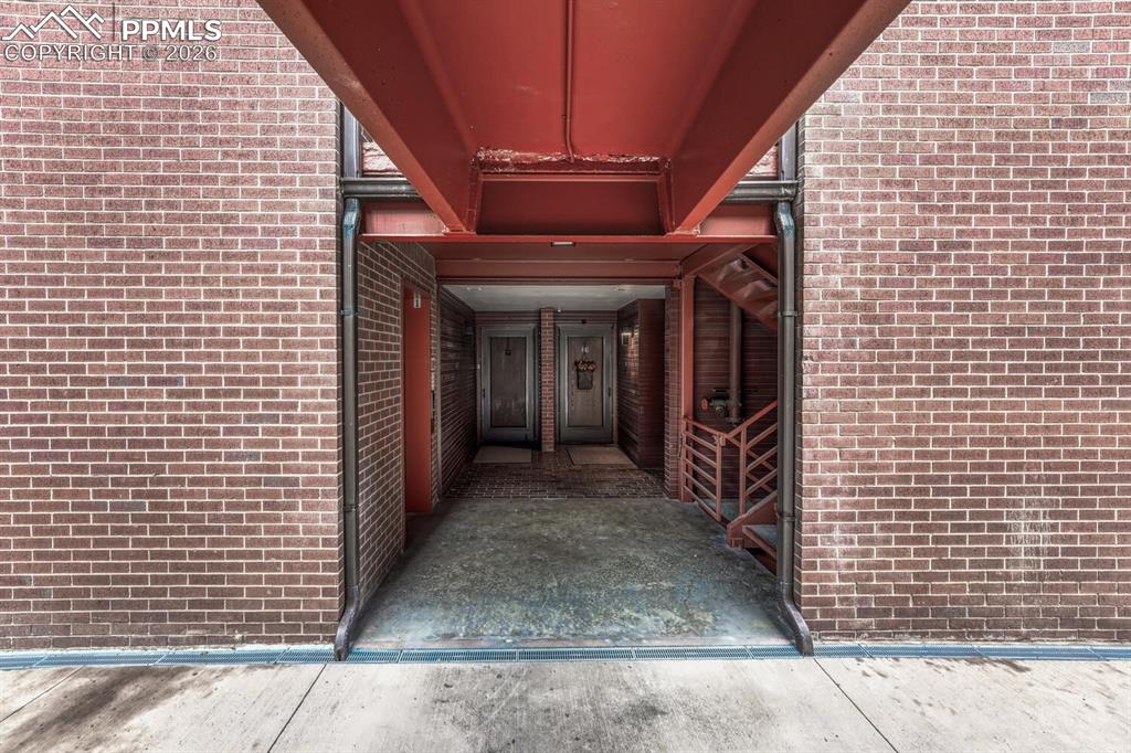 75 East Boulder Street Colorado Springs, CO 80903 - Photo 5 of 50 a view of a pathway along the building