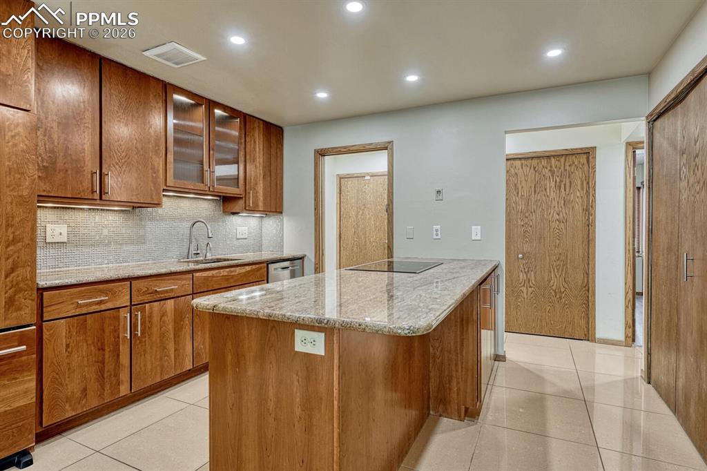 75 East Boulder Street Colorado Springs, CO 80903 - Photo 8 of 50 a kitchen with stainless steel appliances granite countertop a sink and a refrigerator