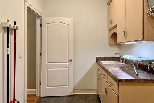 a kitchen with a sink and a refrigerator