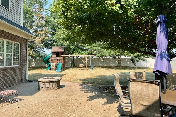a outdoor living space with furniture and a potted plant