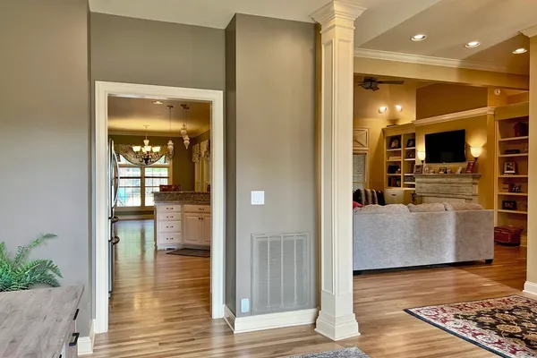 an entryway and livingroom with furniture