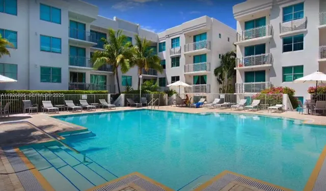 a front view of a building with swimming pool