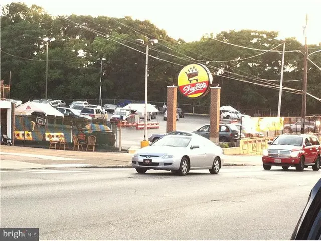 a view of a cars park in front of building