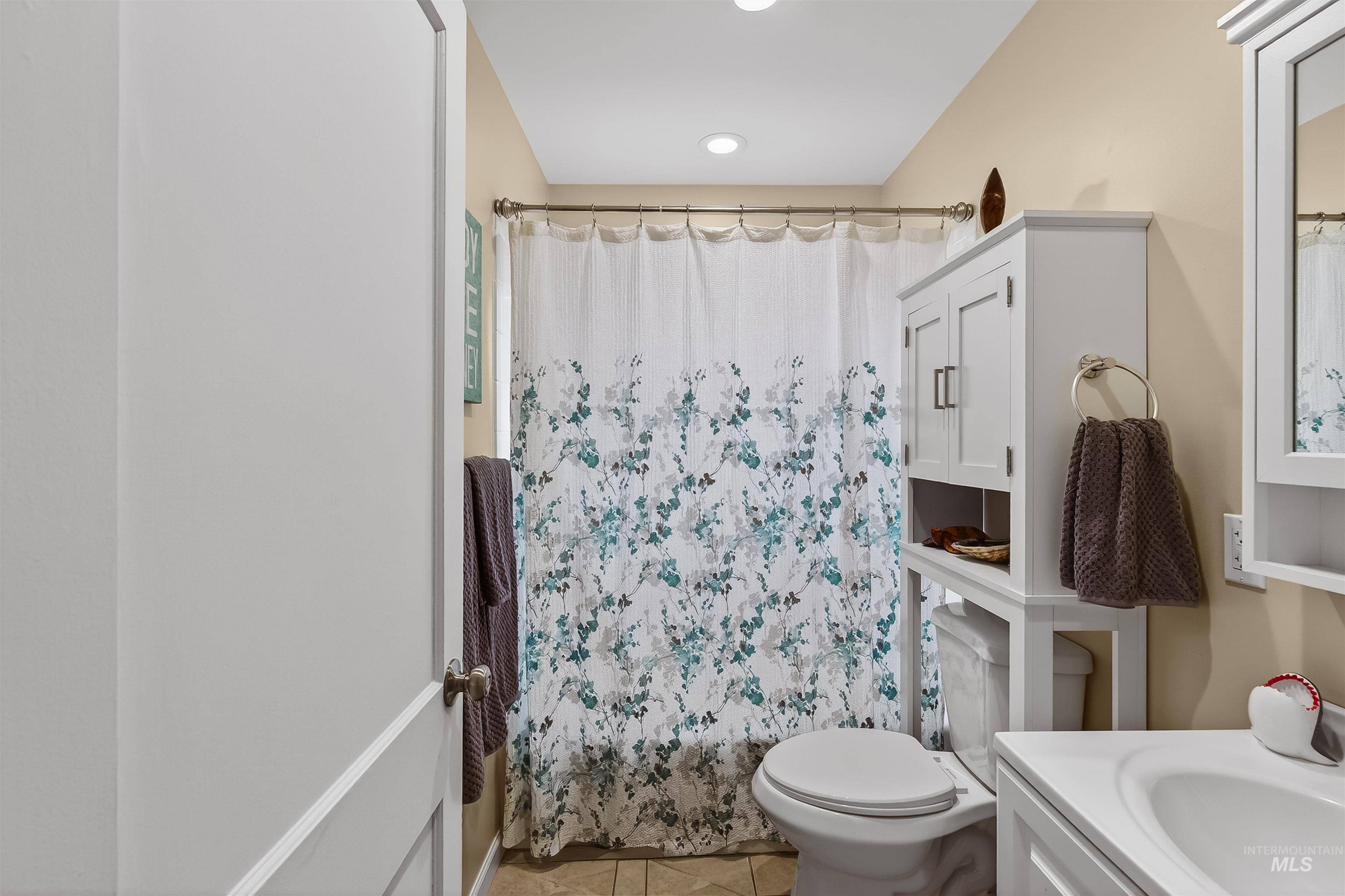 835 12th Street Clarkston, WA 99403 - Photo 11 of 39 Bathroom featuring vanity and light tile patterned floors