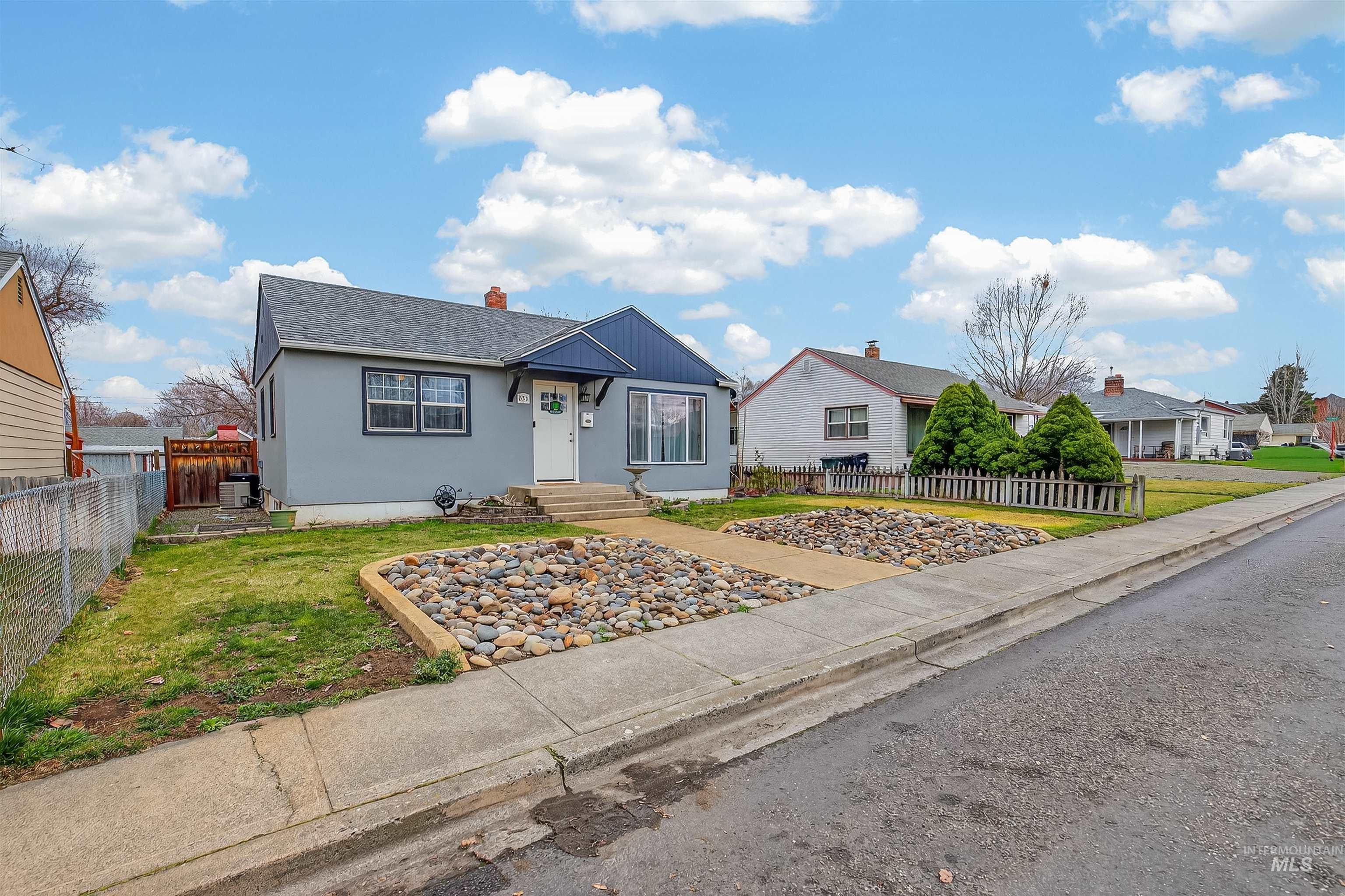 835 12th Street Clarkston, WA 99403 - Photo 2 of 39 View of front of home featuring a chimney, stucco siding, and a shingled roof