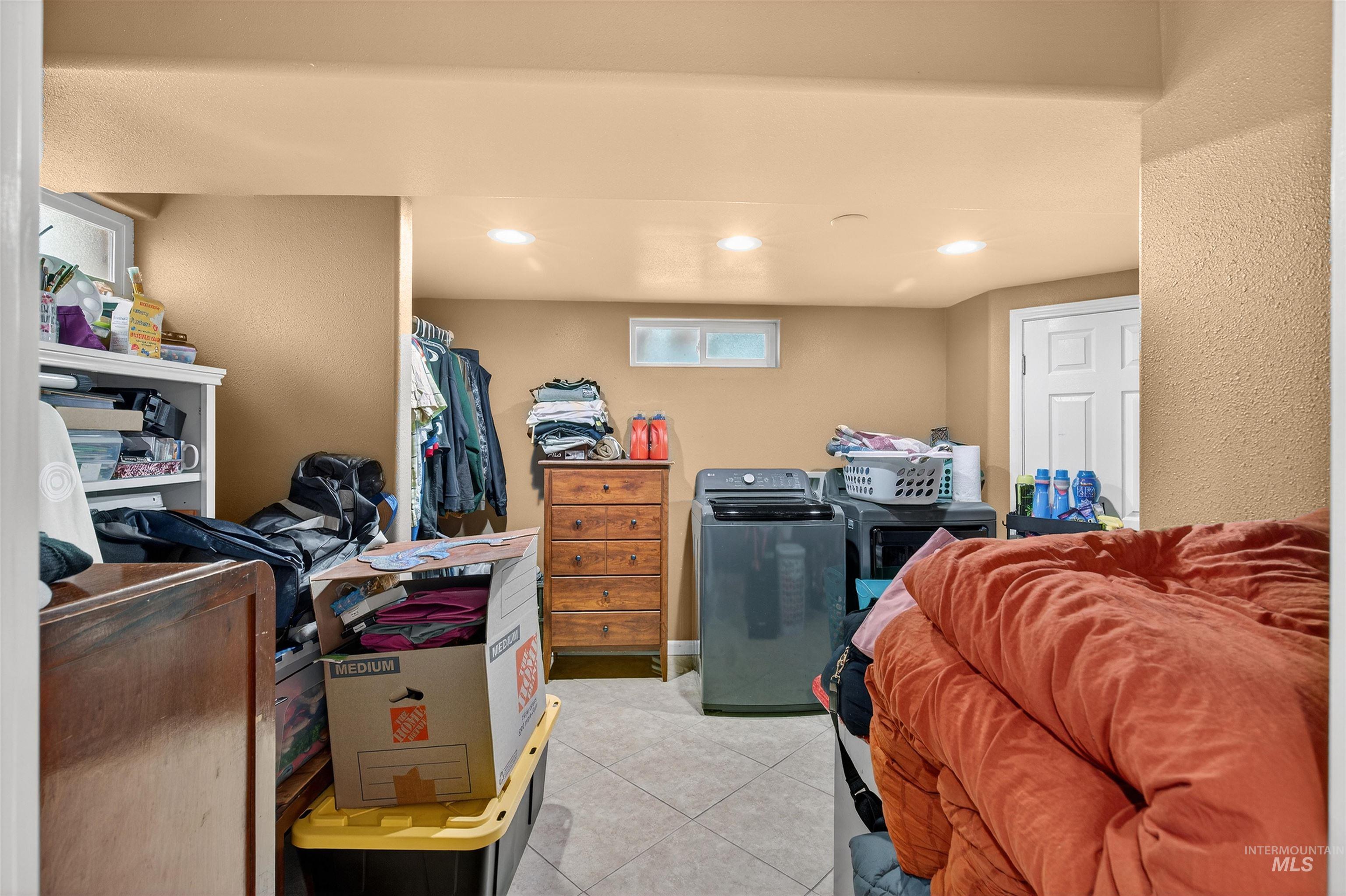 835 12th Street Clarkston, WA 99403 - Photo 21 of 39 Interior space with recessed lighting, light tile patterned flooring, and independent washer and dryer