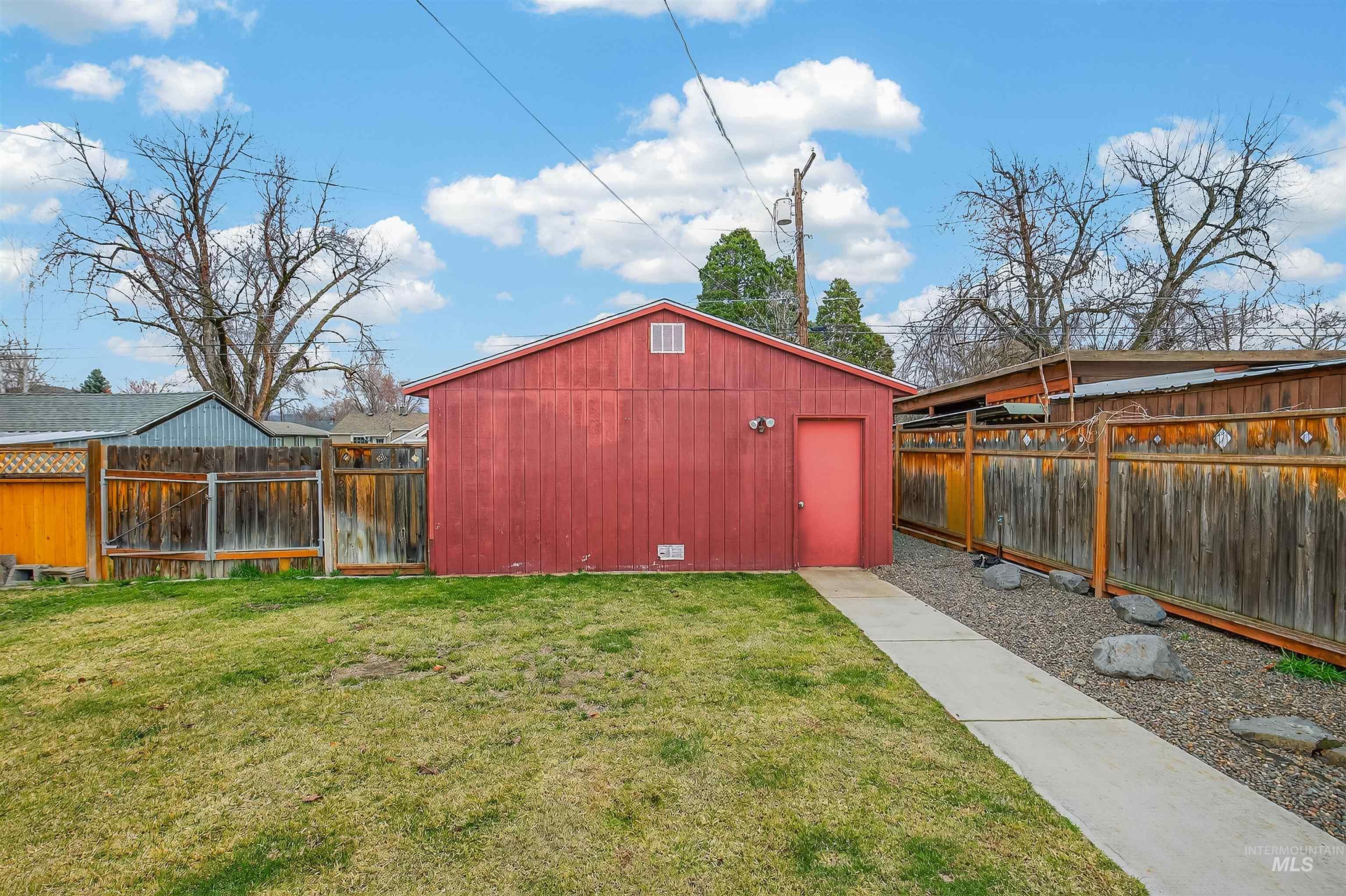 835 12th Street Clarkston, WA 99403 - Photo 32 of 39 Fenced backyard with an outdoor structure