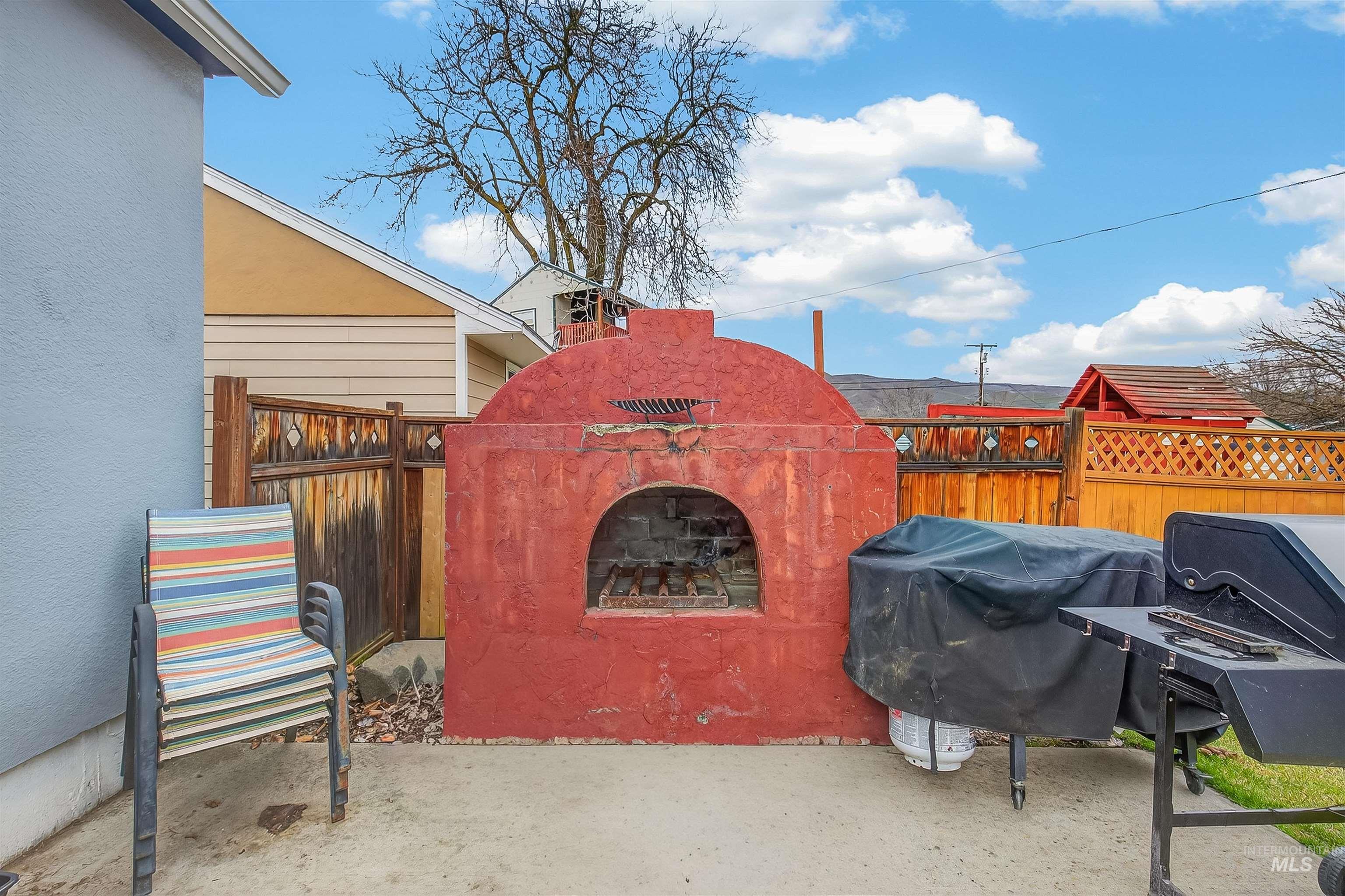 835 12th Street Clarkston, WA 99403 - Photo 39 of 39 View of patio / terrace with grilling area and a fireplace