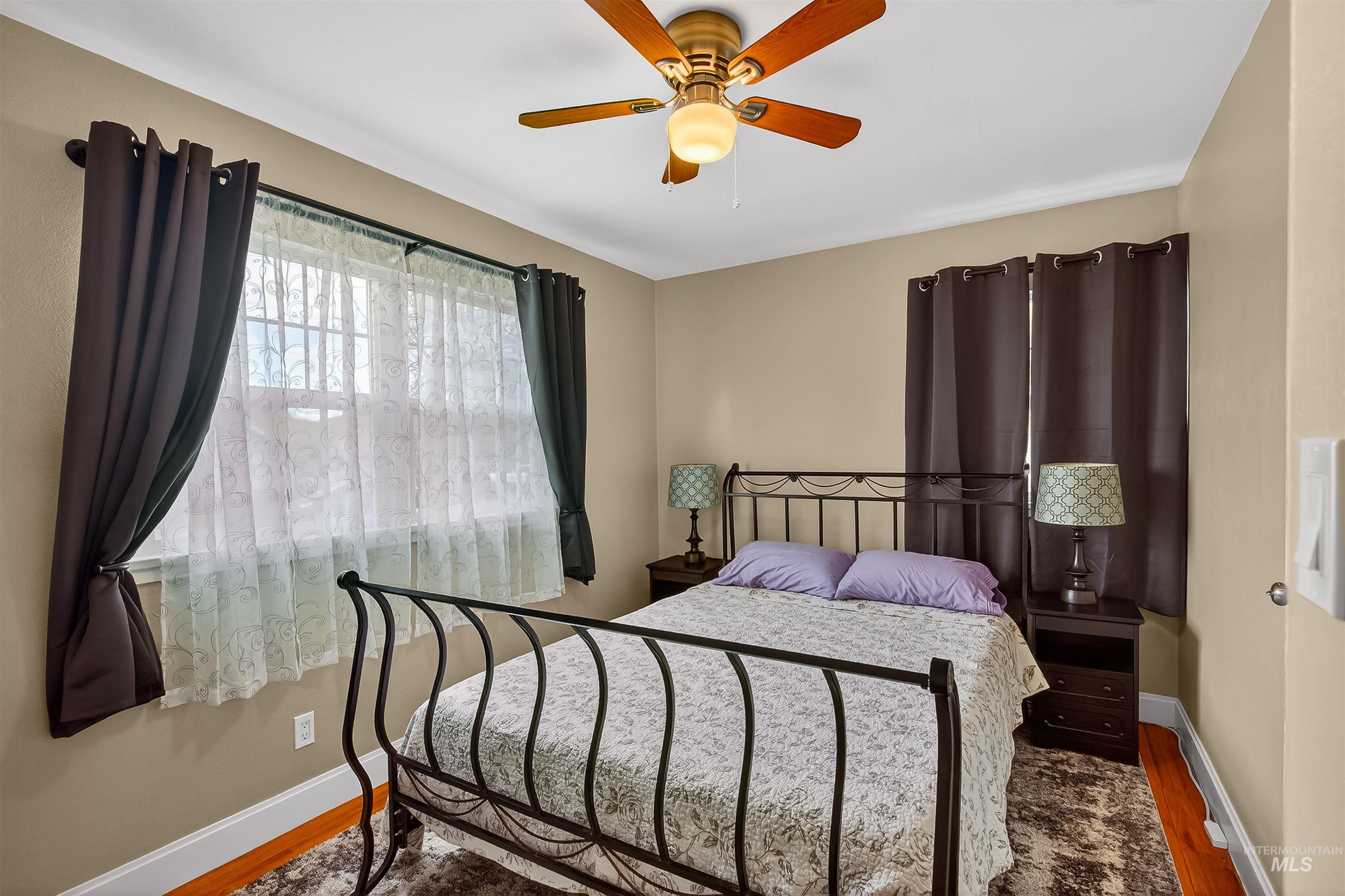 835 12th Street Clarkston, WA 99403 - Photo 8 of 39 Bedroom featuring wood finished floors and ceiling fan