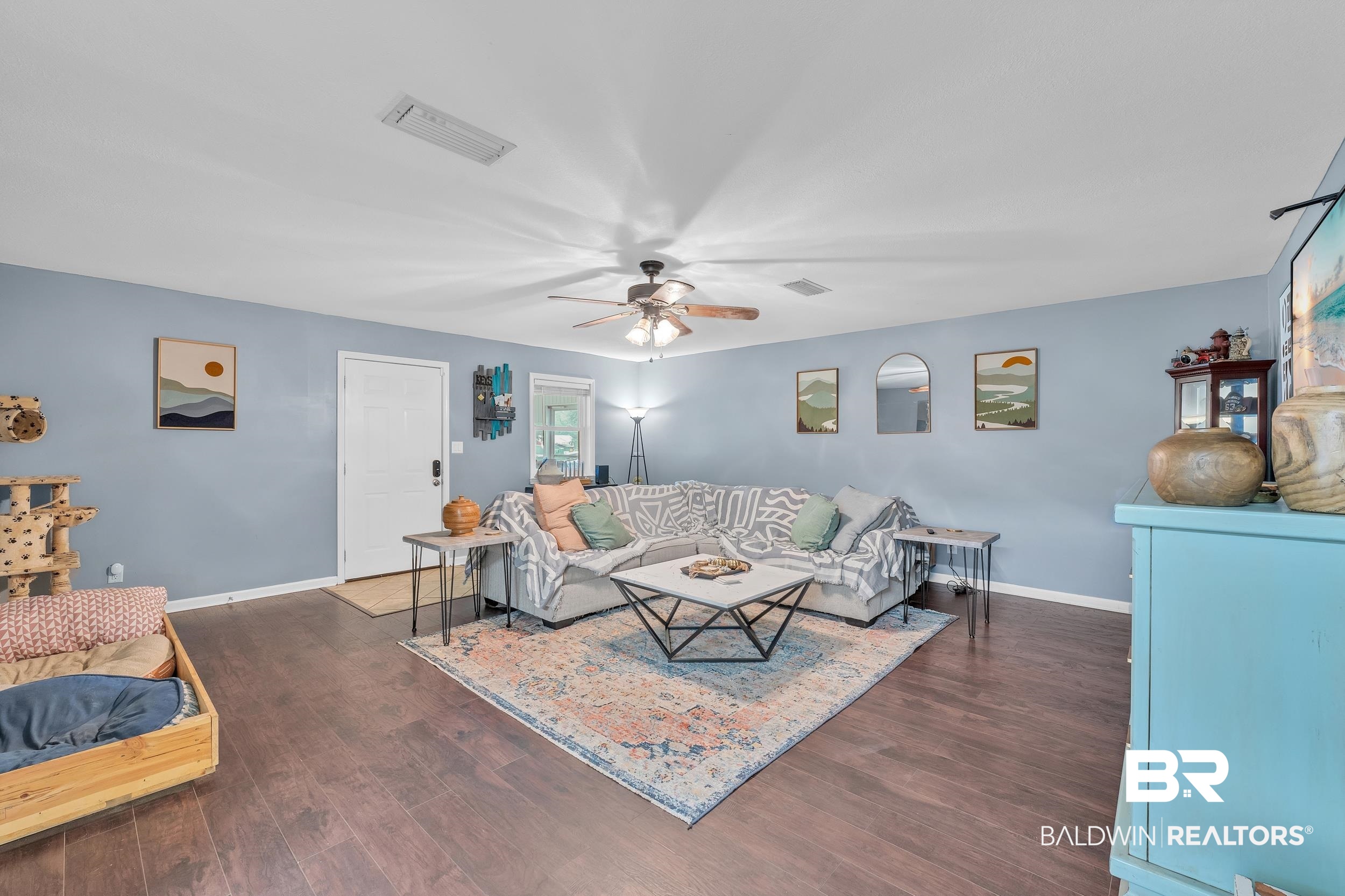 206 West Jackson Avenue Summerdale, AL 36580 - Photo 12 of 37 Living room featuring ceiling fan, wood finished floors, and baseboards