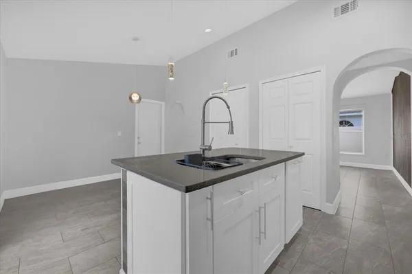 a kitchen with a sink and cabinets