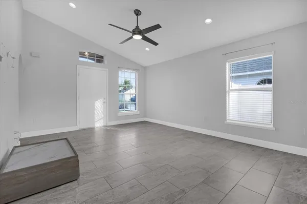 a view of an empty room with a window