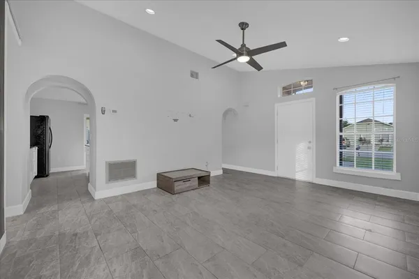 a view of an empty room with a window