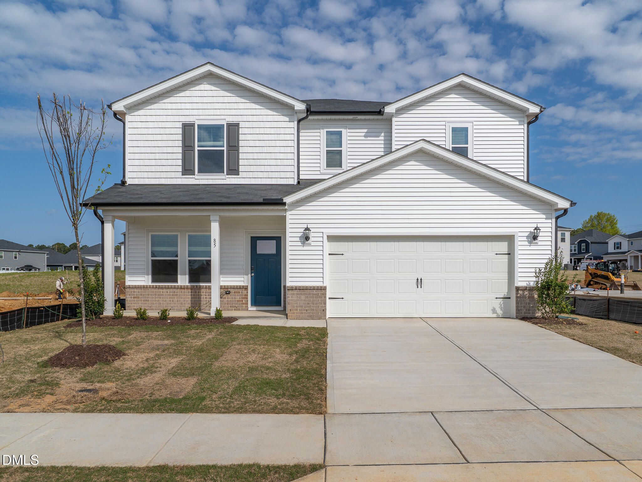 a front view of a house with garage