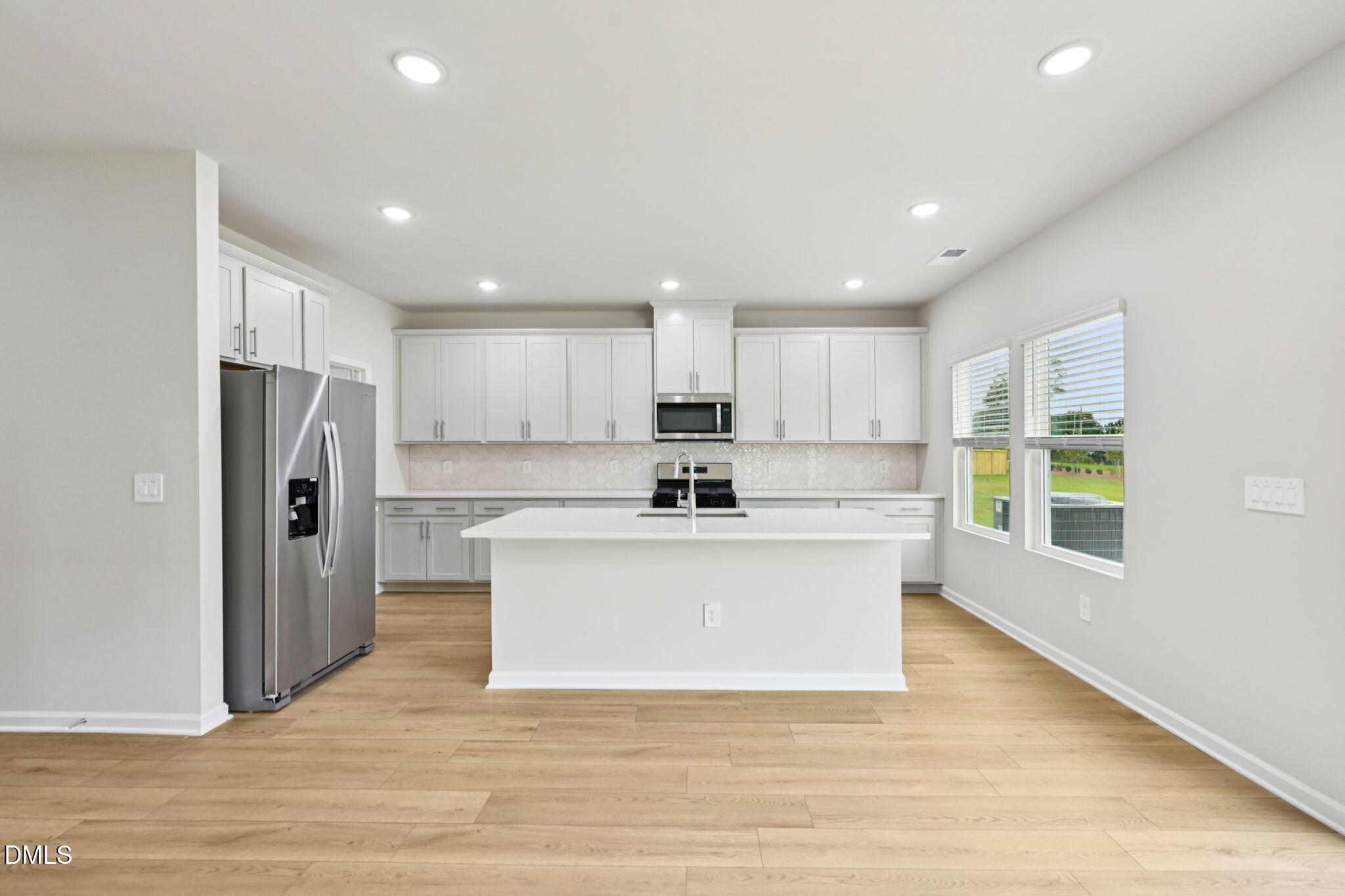 85 Thistle Patch Place Angier, NC 27501 - Photo 13 of 40 a view of kitchen with stainless steel appliances refrigerator sink and cabinets