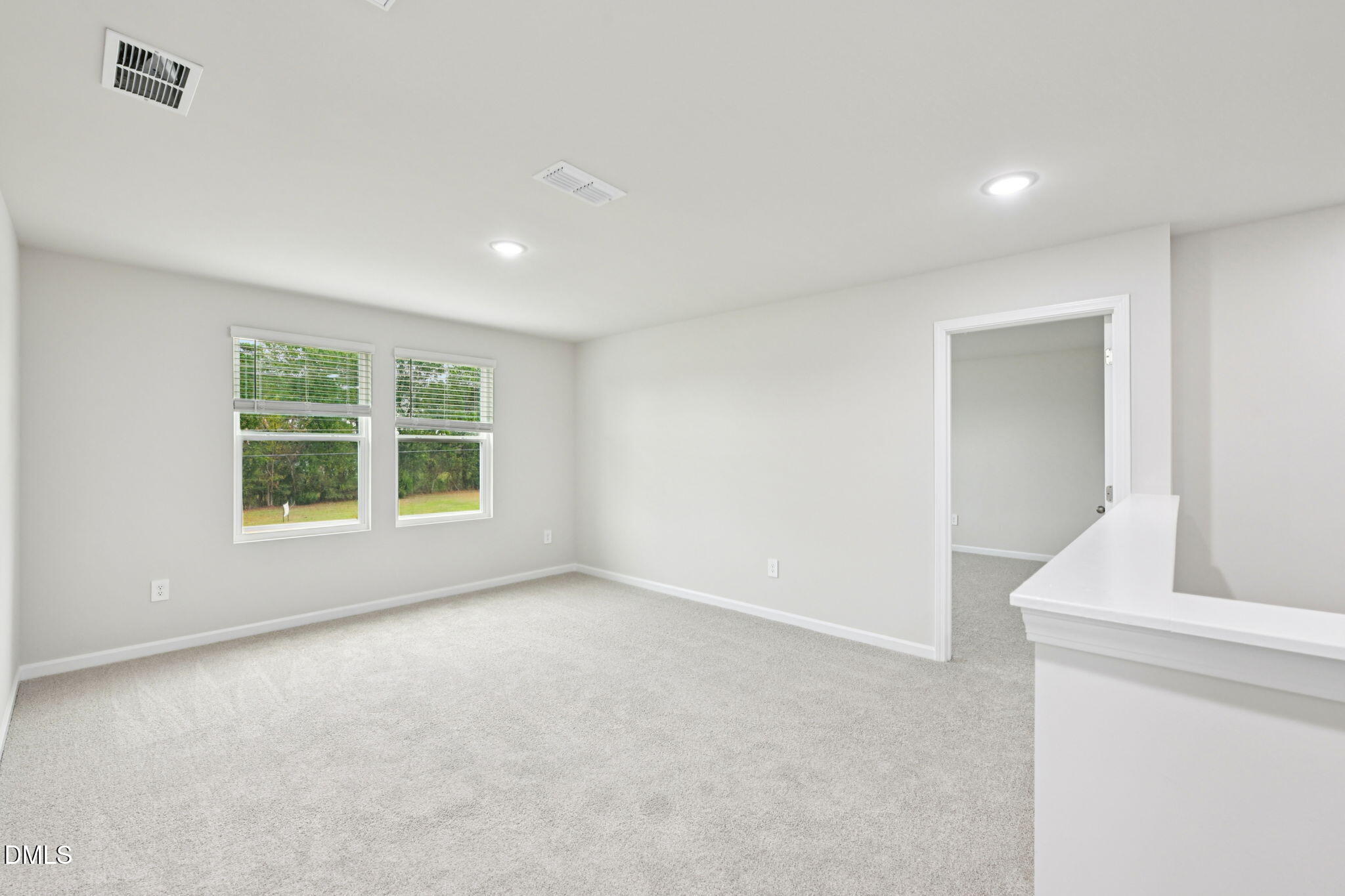 85 Thistle Patch Place Angier, NC 27501 - Photo 19 of 40 a view of an empty room with a window