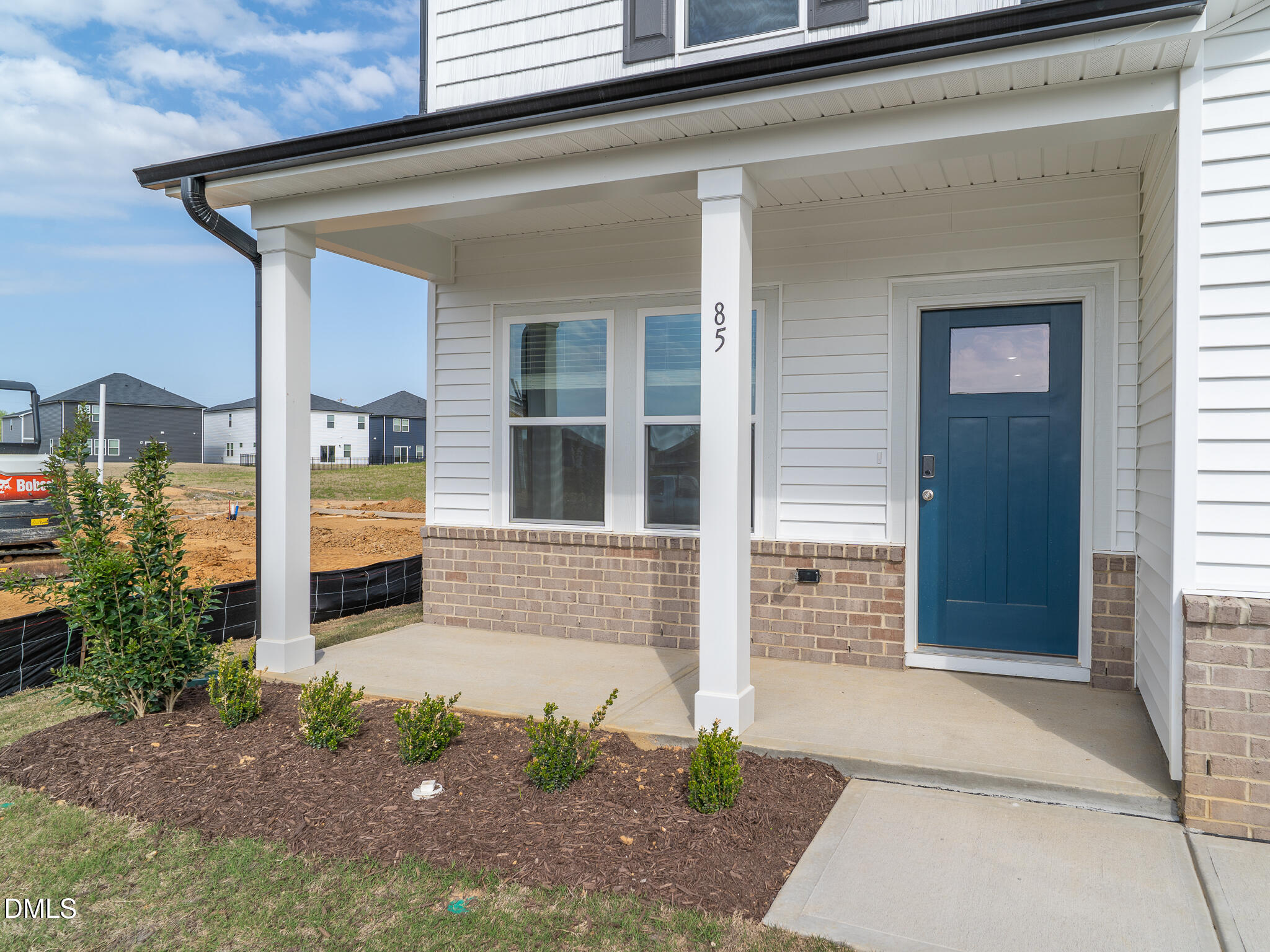 85 Thistle Patch Place Angier, NC 27501 - Photo 2 of 40 a front view of a house with a garage
