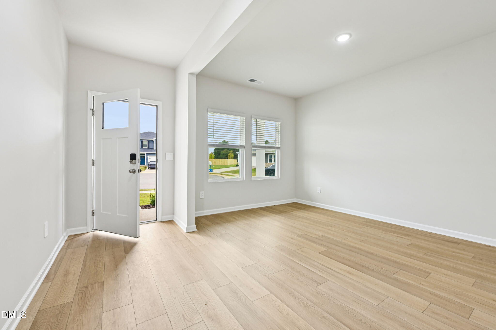 85 Thistle Patch Place Angier, NC 27501 - Photo 5 of 40 an empty room with window and wooden floor