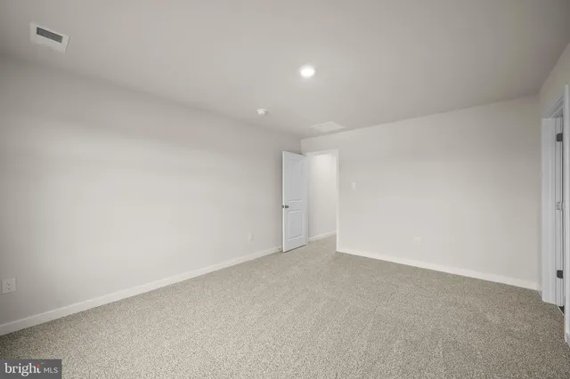a bathroom with a sink mirror and shower