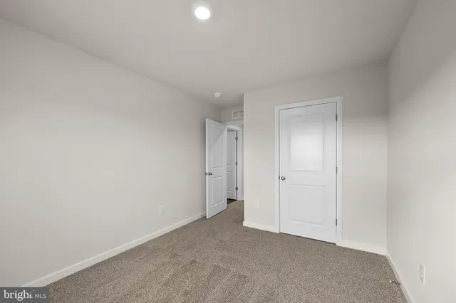 a bathroom with a toilet and a bathtub