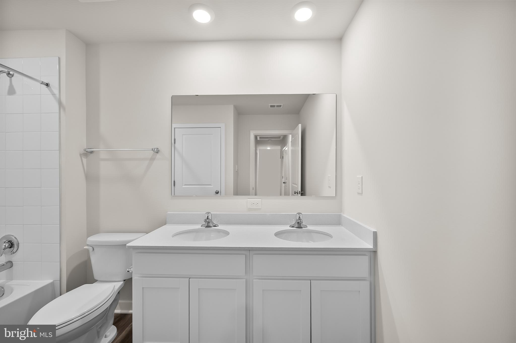 258 Eclipse Street Ranson, WV 25438 - Photo 27 of 46 a bathroom with a sink toilet and a mirror