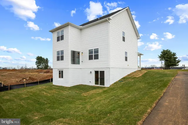 a house view with swimming pool and mountains in the background