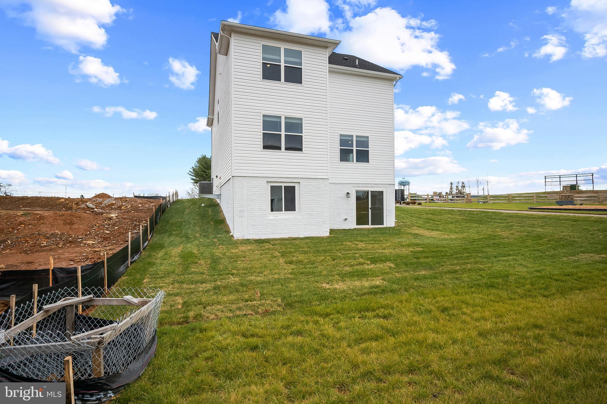 258 Eclipse Street Ranson, WV 25438 - Photo 37 of 46 a house view with swimming pool and mountains in the background