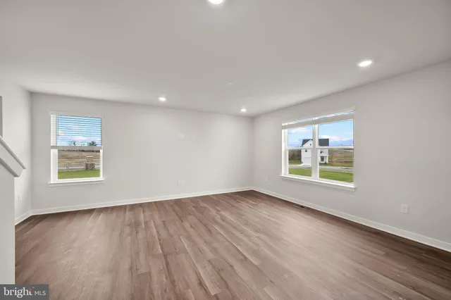 a kitchen with stainless steel appliances a refrigerator a sink a stove a microwave and island