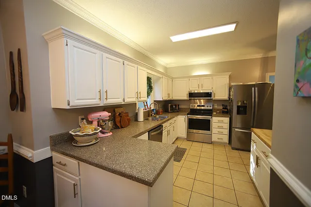 a living room with a fireplace and a couch